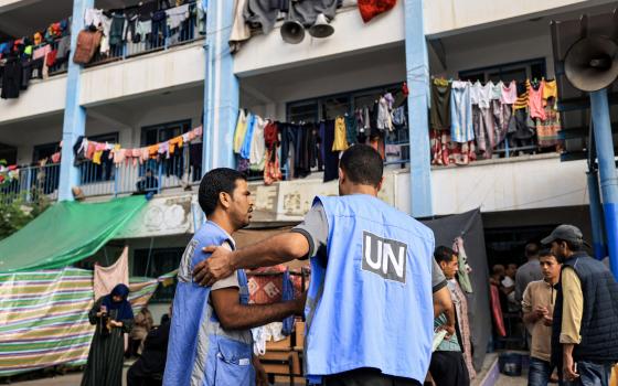 عاملان من الأونروا في مدرسة نزوح في غزة